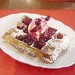 Brussel's waffle with ice cream and stewed strawberries or cherries